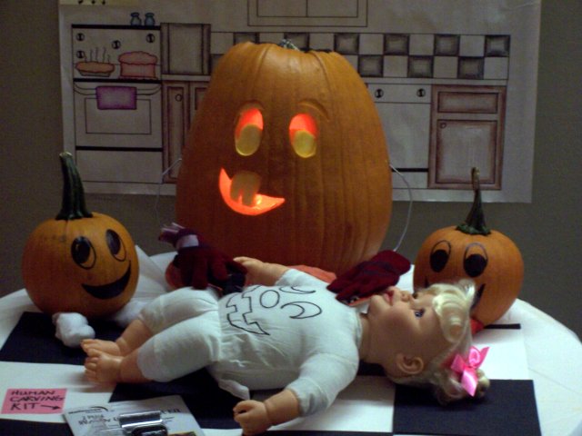 Pumpkins preparing a child to be carved for Halloween