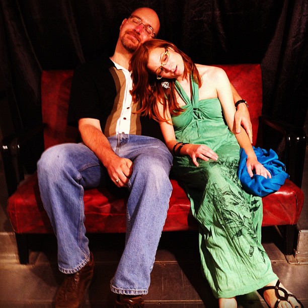 Photograph of me and Jacqui Vandale, asleep on a red couch